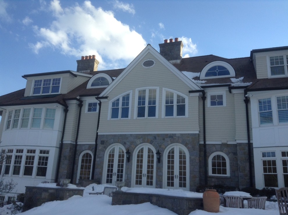 Rear elevation of a residence with a dark architectural roof